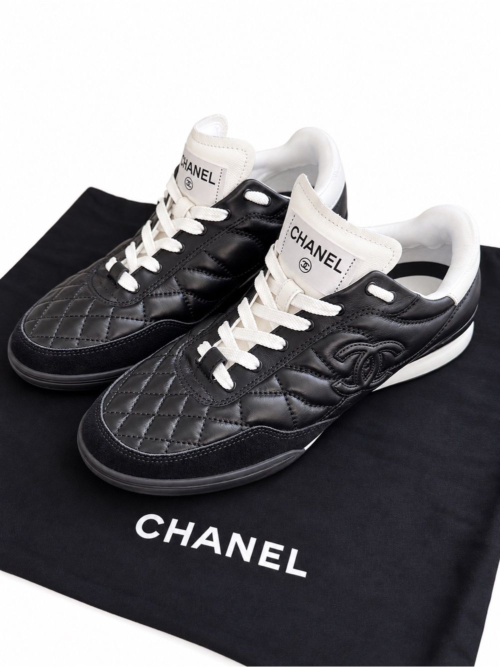 CHANEL Black Quilted Leather Women’s Sneakers with White Accents